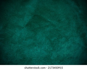 Dark green old velvet fabric texture used as background. Empty green fabric background of soft and smooth textile material. There is space for text.	