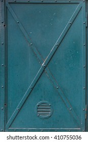 Dark green old vintage metal door.
