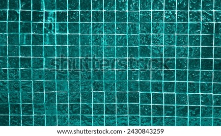 dark green square mosaic tiles texture use as background in close up view. grungy glass tiles for decoration for luxury, rich, elegant, humble style concept.