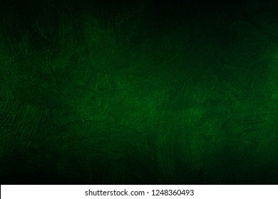 Dark green wall texture for designer background. Artistic plaster. Rough lighted surface. Abstract pattern. Bright backdrop. Raster image.