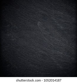 Dark grey black slate background or texture - Shutterstock ID 1052014187