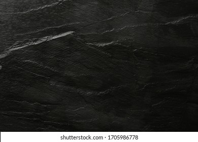 Dark grey and black slate background or texture. Flat lay top view copy space.