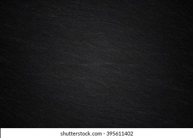 Dark grey black slate background natural stone texture 