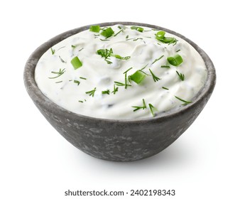 Dark grey ceramic bowl of fresh sour cream dip sauce with herbs isolated on white background - Powered by Shutterstock