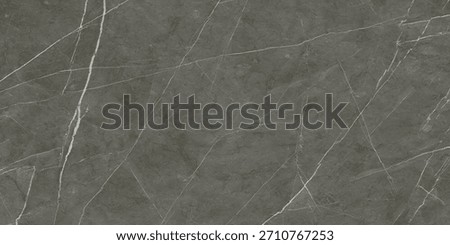 Dark grey marble surface with thin white veining patterns creating an elegant and sophisticated texture. The overall appearance is smooth and polished.
