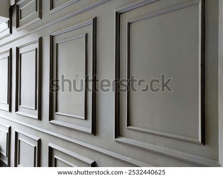 Dark grey square shape wainscoting.