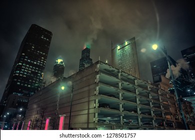 Dark And Gritty Chicago City Skyline At Night During Fog