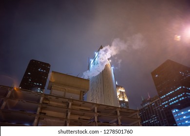 Dark And Gritty Chicago City Skyline At Night During Fog