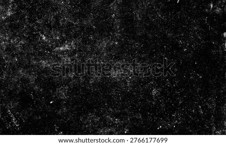 Dark gritty texture featuring fine white dust particles and subtle scratches layered over a deep black surface for creative artistic projects