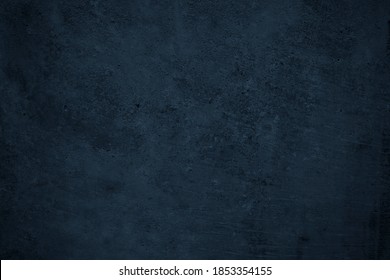   Dark grunge background. Black blue abstract rough background with space for design.   Toned concrete wall texture.                              Foto stock