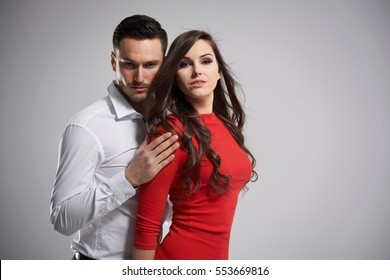 Dark Hair Couple On Gray Background
