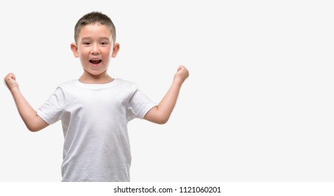 Dark haired little child screaming proud and celebrating victory and success very excited, cheering emotion - Powered by Shutterstock