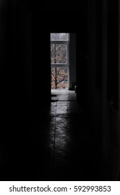 Dark hallway. Diffused light that emanates from the window of a corridor. Exit concept. 