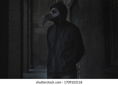 Dark Horror Figure In Black Hood In Plague Doctor Mask 