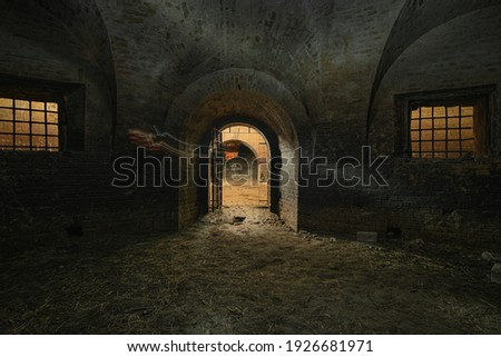 Dark interior of the old abandoned empty underground casemate flank of the Kyiv fortress of the 18th-19th centuries.