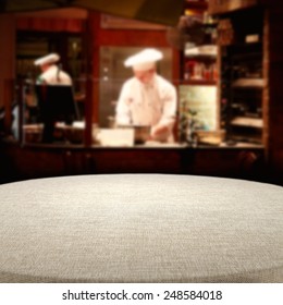 Dark Interior Of Restaurant And Table Cloth Of Brown Color 