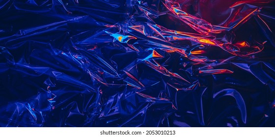 Dark iridescent transparent plastic texture with colorful light - Shutterstock ID 2053010213