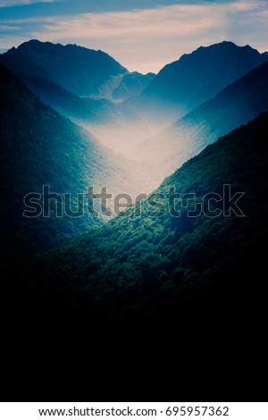 Dark landscape with mountains at sunset over Pyrenees. Perfect background for smart phone smartphone or tablet