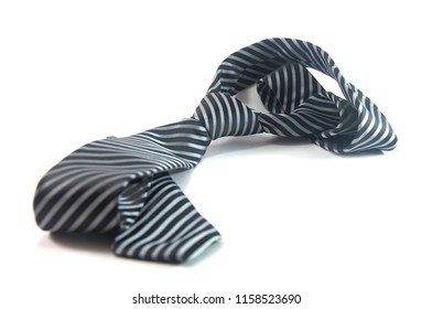Dark and light gray stripe necktie isolated on white background with shadow, first jobber men for formal shirt