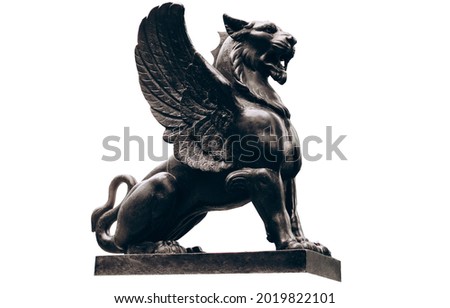 Dark lion sculpture with wings isolated on white background.