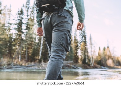 Dark men's trousers on a walk - Shutterstock ID 2227763661