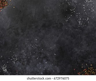 Dark Mica Background. Stone Texture With Sea Salt And Pepper. Spices Laying On Stone Surface. Empty Space For Text. Can Be Used For Food Posters, Design Of Menu And Outdoor Commercial