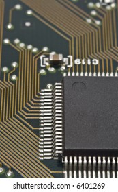 A dark microprocessor on a circuit board.