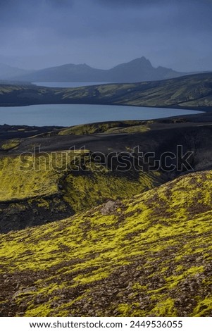 A dark, midday view of the rugged and remote highlands from the top of Laki volcano, Lakagígar crater row, Iceland.