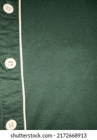 Dark Mint Green Shirt Close Up With White Line And Buttons. Plain Dark Green Color Shirt Fabric Texture, Button-up Top. Cotton Polo Style T-shirt Close Up View, Casual Clothes Detail