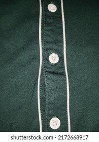 Dark Mint Green Shirt Close Up With White Line And Buttons. Plain Dark Green Color Shirt Fabric Texture, Button-up Top. Cotton Polo Style T-shirt Close Up View, Casual Clothes Detail