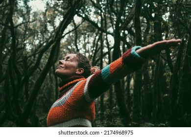 Dark Mood Nature Lover People In The Woods Opening Arms To Embrace Trees And Ambient Green Ecology Friendly People In The Forest Standing And Enjoying Oxygen And Scenic Place. Travel Lady Destination