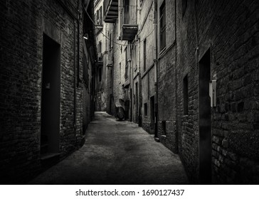 A Dark And Moody Back Alley Taken In The Historic Town Of  Recanati, Macerata, Marche, Italy