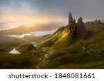 Dark and moody low clouds over the iconic Old Man of Storr on the Isle of Skye, Scotland, UK.