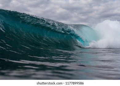 dark moody ocean, large wave crashing 