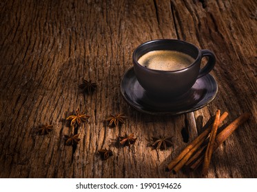 Dark And Moody Tone Of A Coffee Cup Anises And Cinnamon On Rustic Wooden Table. Concept Loft Coffee Shop. Morning Coffee. Top Ten Of People's Favourite Drinks. How To Make Coffee. Handmade Mug.