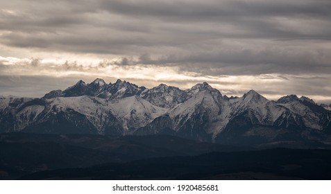 Dark Mountains Under Misty Clouds