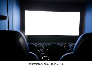 Dark Movie Theatre Interior. Screen And Chairs.