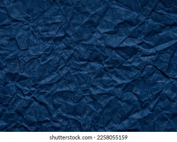 Dark navy blue crumpled paper texture. Blank page pattern for winter season Christmas festival card, new year designs decoration, background concepts, text, lettering, wall screen saver, 3d art work.