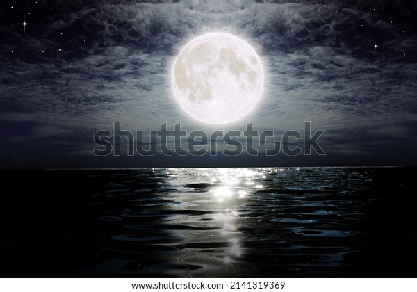 Dark night with big\
full moon over sea water and cloudy sky absent everybody, Credit\
the moon by NASA