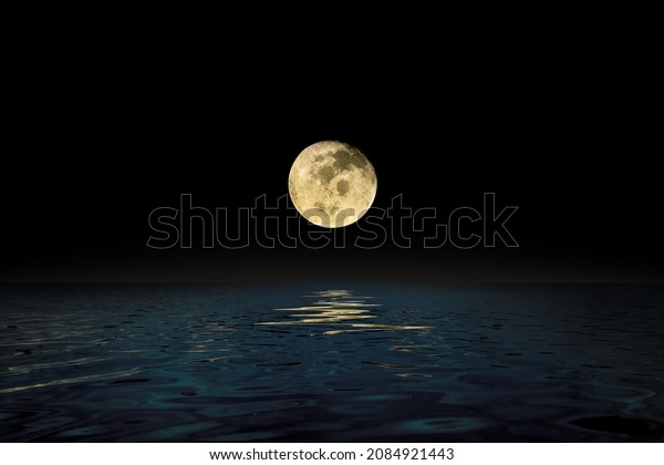 Dark\
night at sea water surface with the big full moon that be curcruit\
orbit to closest the earth, Credit the moon by\
NASA