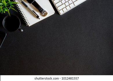 Dark Office Desk Table With Desktop Computer, Smartphone, Coffee And Supplies. Top View, Flat Lay.