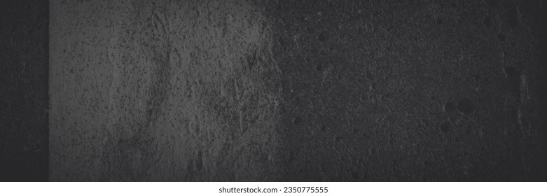Dark panoramic background for design. Torn old faded paper wallpaper with a retro pattern. Ragged scraps of paper on a concrete wall. Shaded vintage tattered paper texture. Wide panorama with vignette