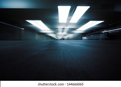 Dark Parking Garage Industrial Room Interior. Zoom Blur Perspective.