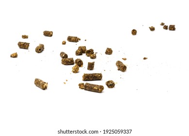 Dark Pellets Of Animal Feed Isolated On White Background. The Concept Of The Composition Of Pellets For Feeding Farm Animals And Fish.