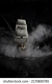 dark photos of the assembled model of a pirate ship