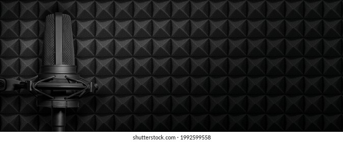 Dark Podcast Or Recording Studio Background With Acoustic Foam And Black Microphone. Audio Banner With Copy Space.