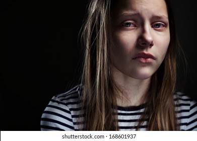 Dark Portrait Of A Crying Teen Girl, Studio Shot