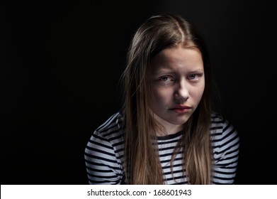 Dark Portrait Of A Crying Teen Girl, Studio Shot