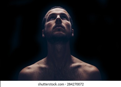 Dark Portrait Of An Handsome Man Looking Up