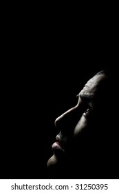 Dark Portrait Of A Man Looking Up